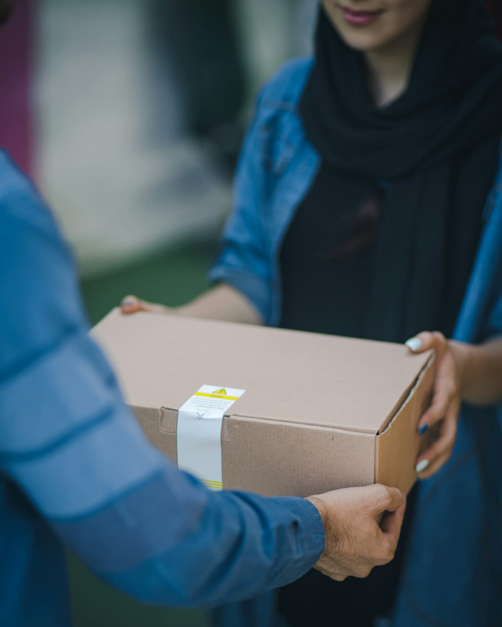 Courier handling parcel delivery and logistics paperwork